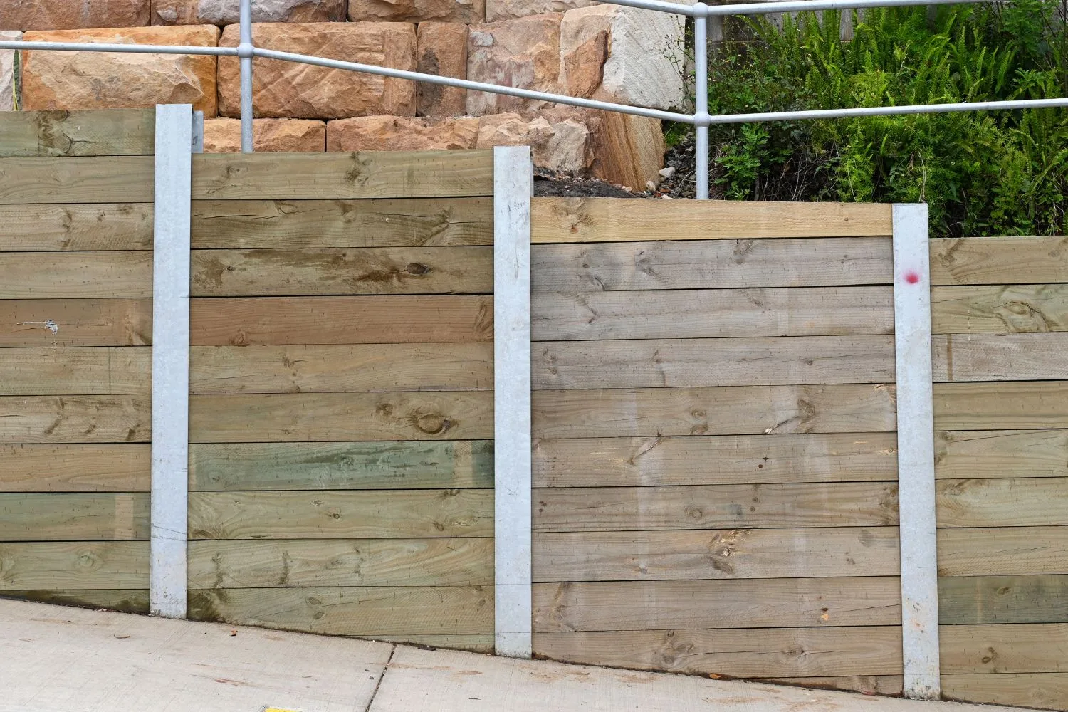 Timber sleeper retaining wall with galvanised steel posts